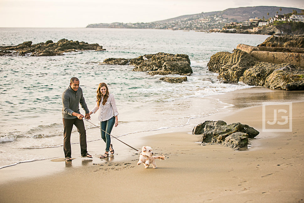 Engagement photos at the beach with their dog