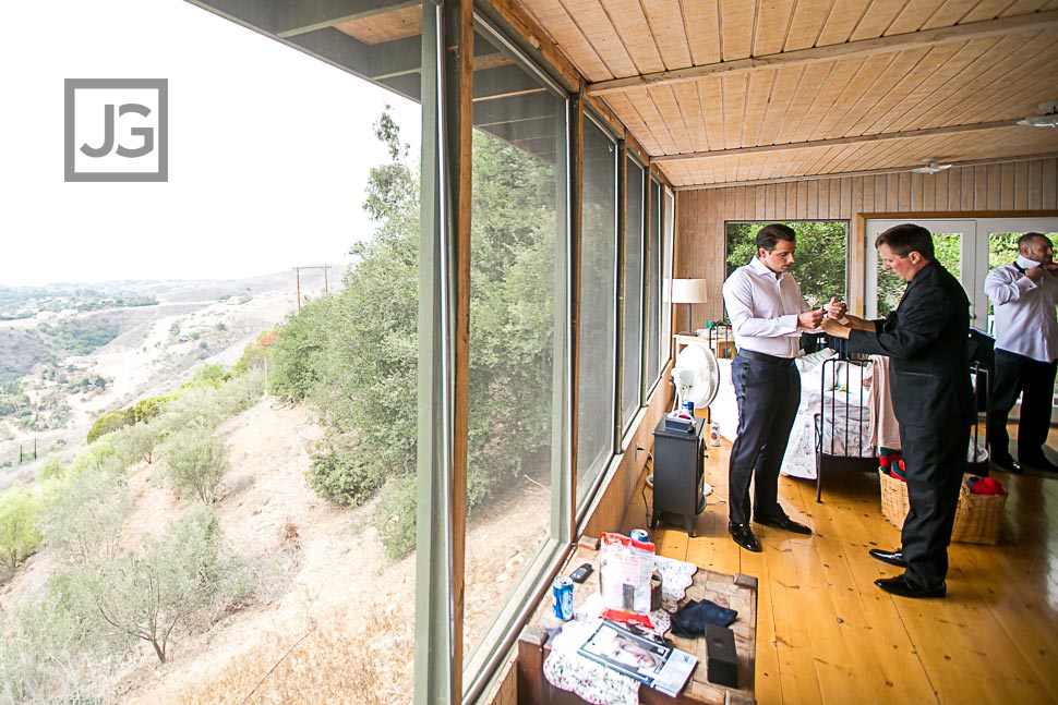 Groom getting dressed at Rancho del Cielo