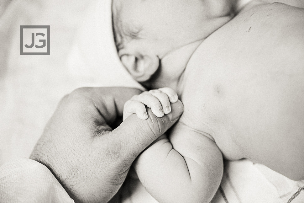 Newborn holding my finger