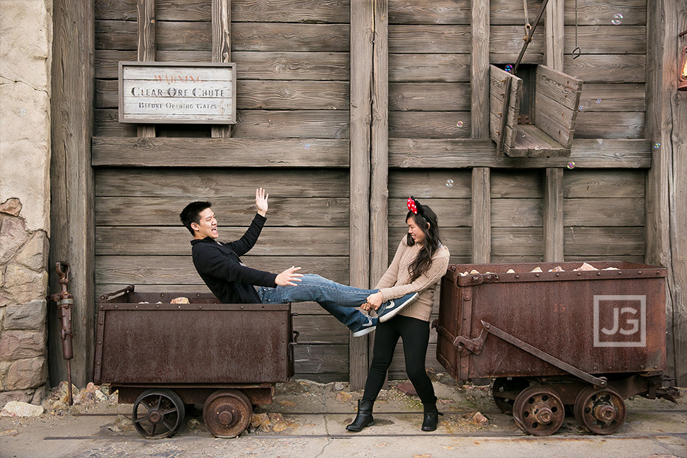 Engagement photos at California Adventures with Mining Carts