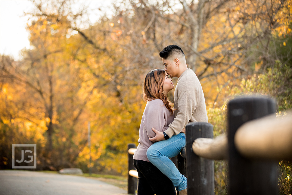 Park Trail Engagement Photography with a Wooden Fence