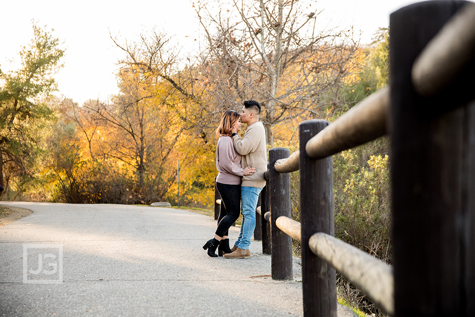 Park Trail Engagement Photography with a Wooden Fence