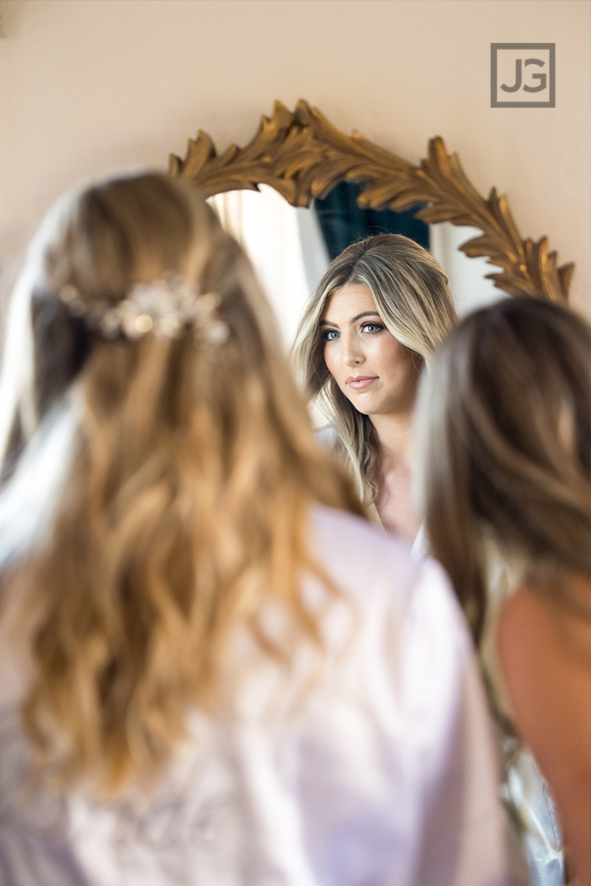 Bride looking in mirror