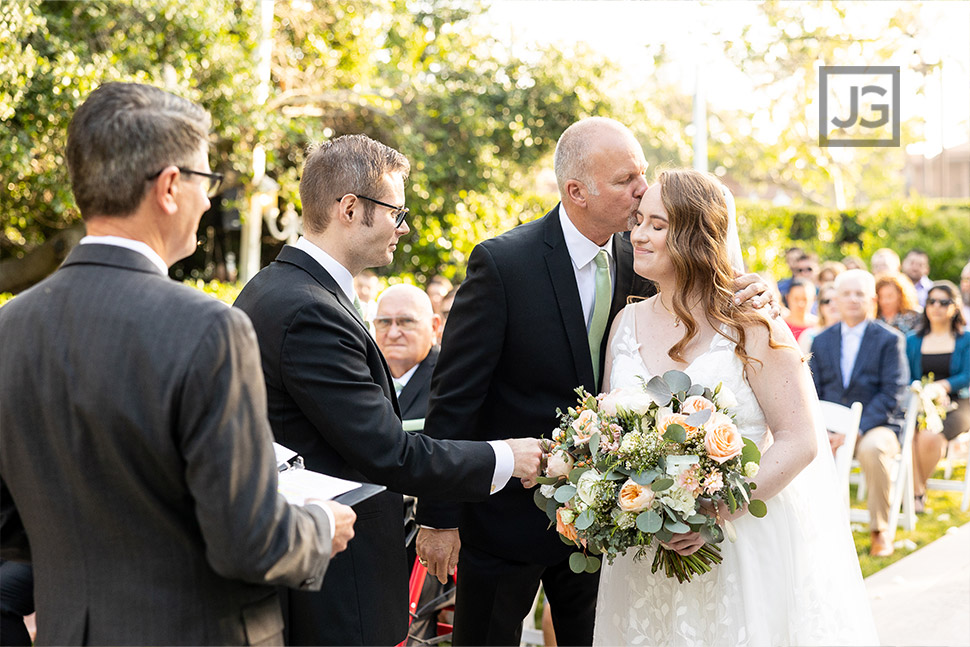 Dad handing off daughter