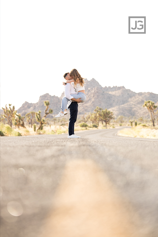 Couple hugging in the middle of a road