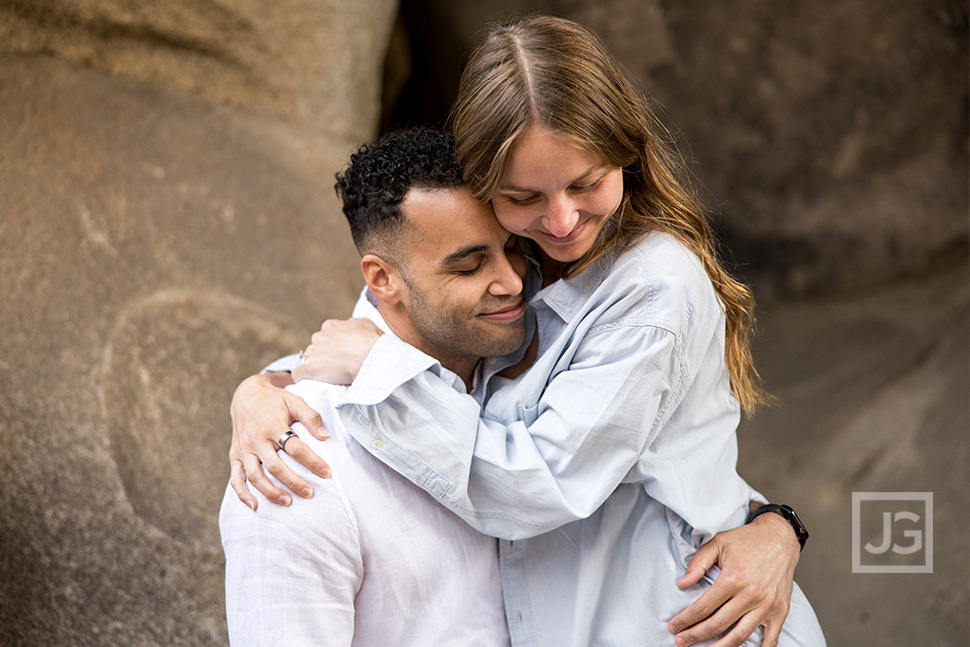 Couple cuddling in Joshua Tree