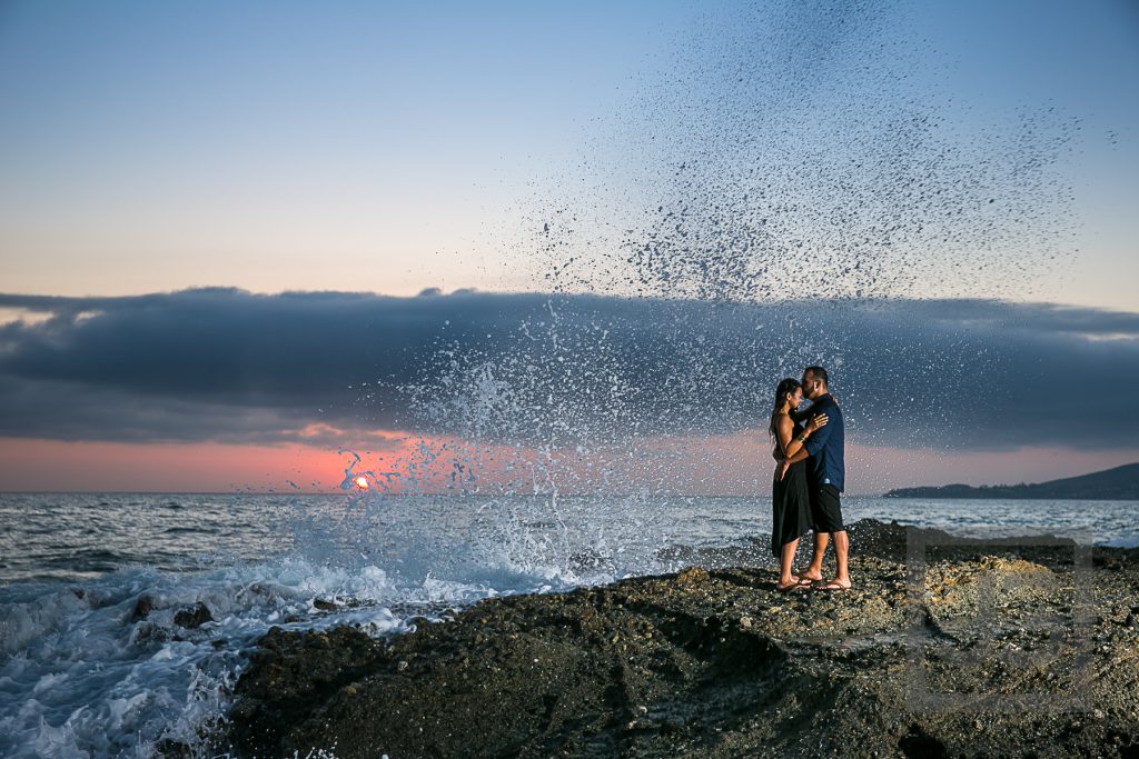 Laguna Beach Engagement Photo with wave and sunset