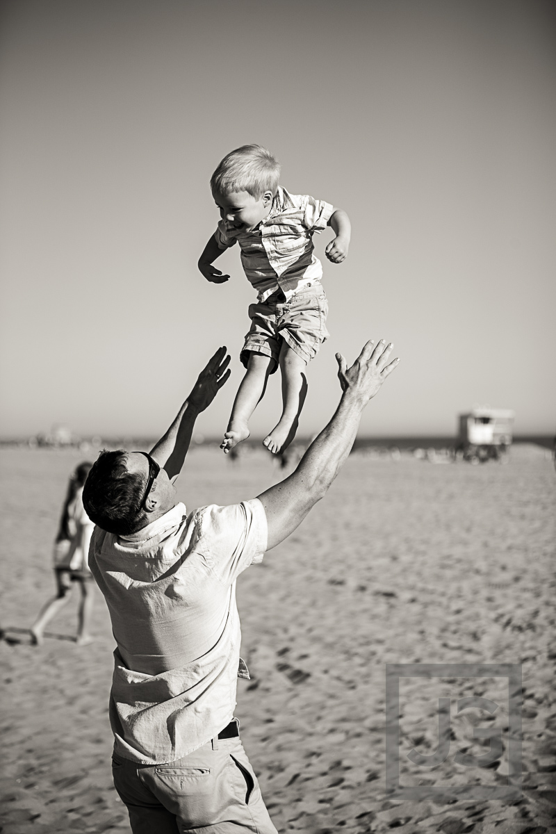 Hilton Waterfront Wedding Candid Photo Baby in Air